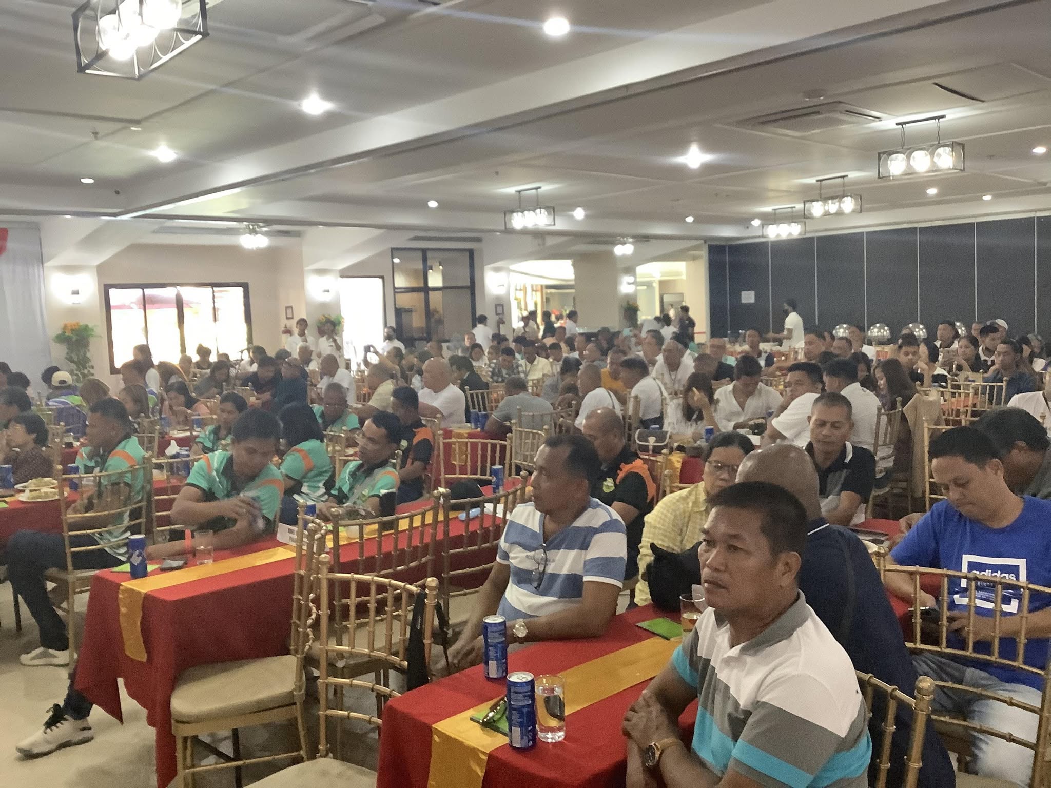 Barangay officials filling a seminar hall at an LGCD training session